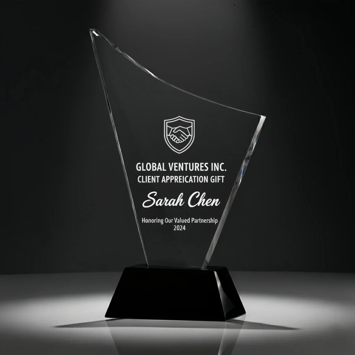 Personalised curved crystal keepsake for business appreciation.