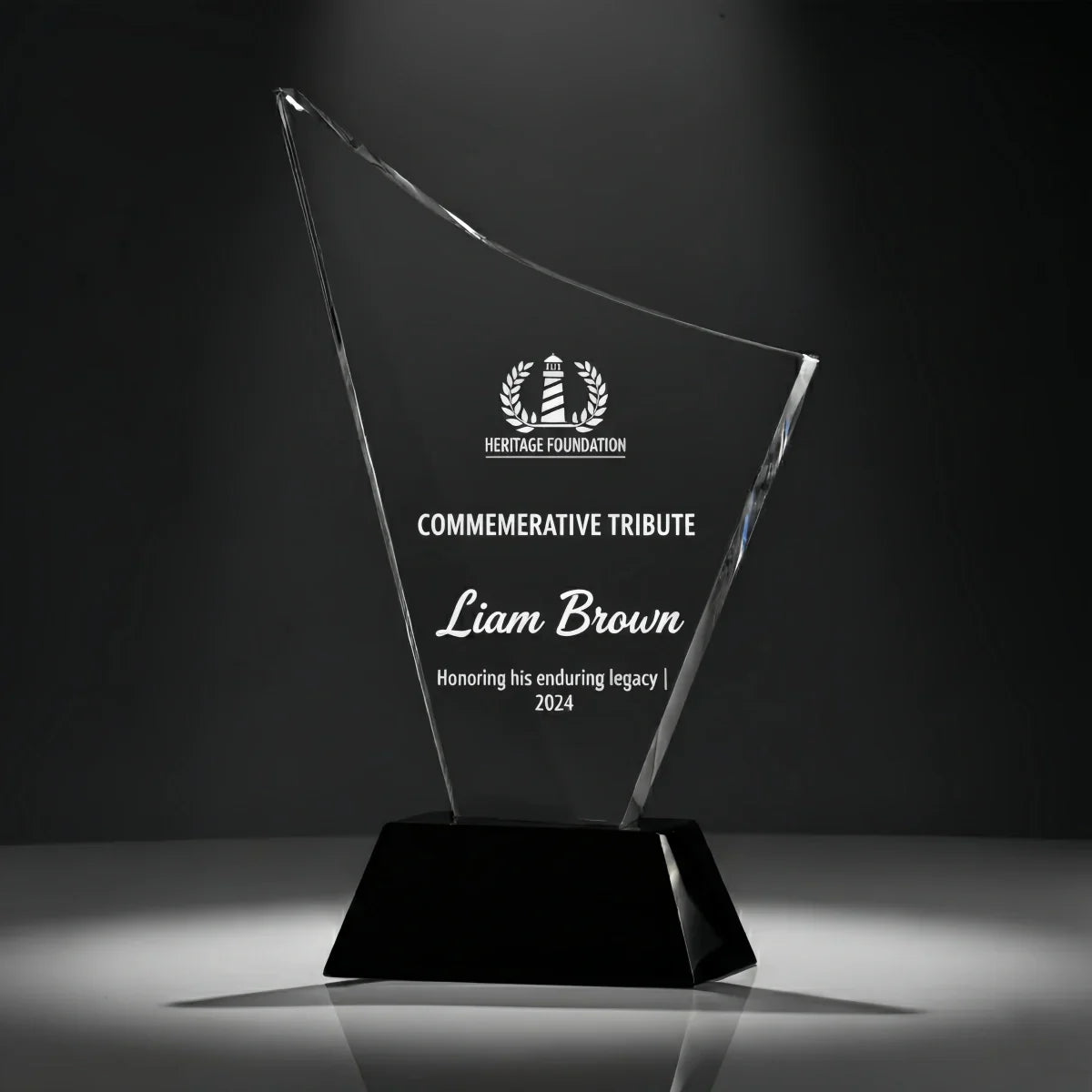 Smooth curved crystal award engraved for commemorative occasions