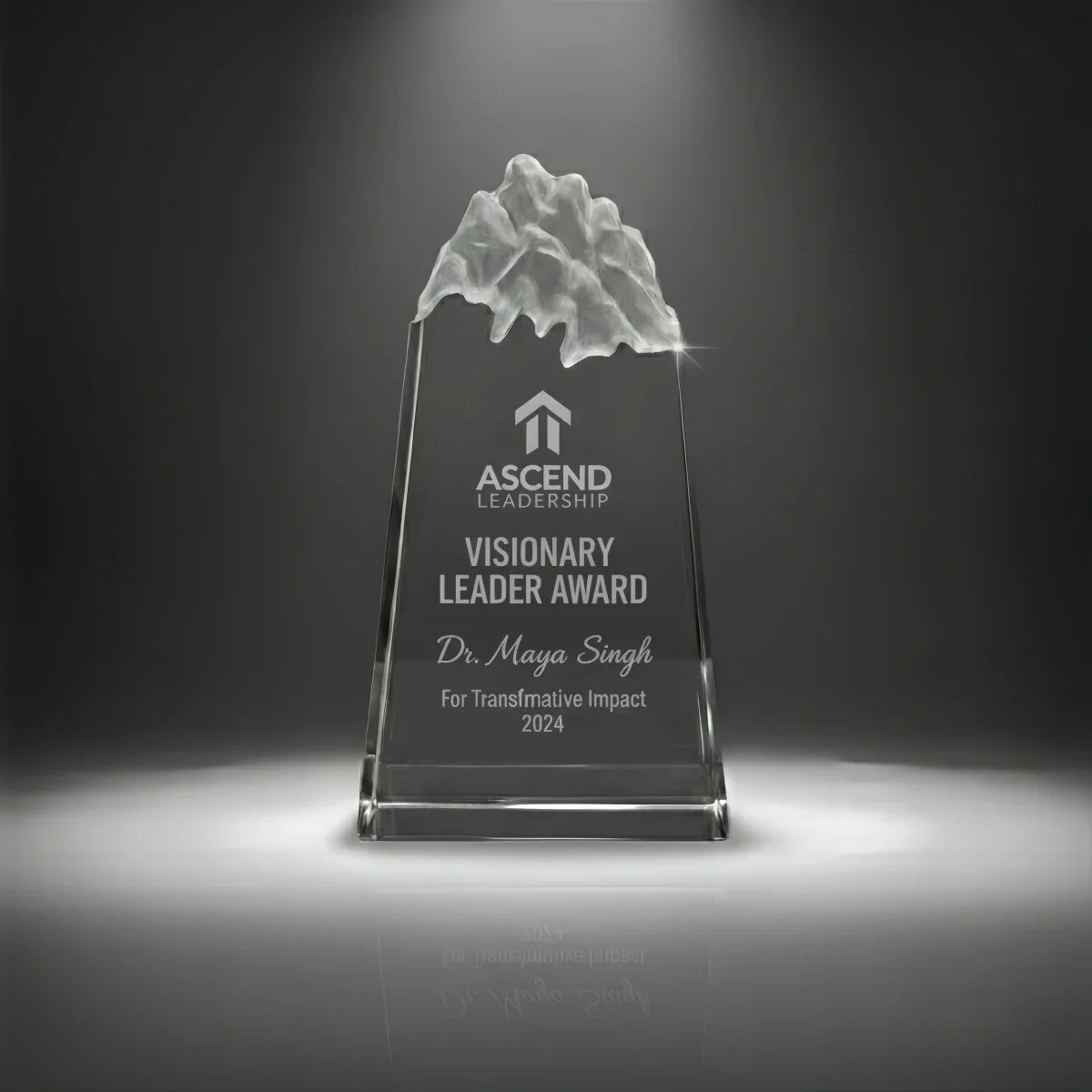 Engraved peak crystal award recognizing leadership excellence