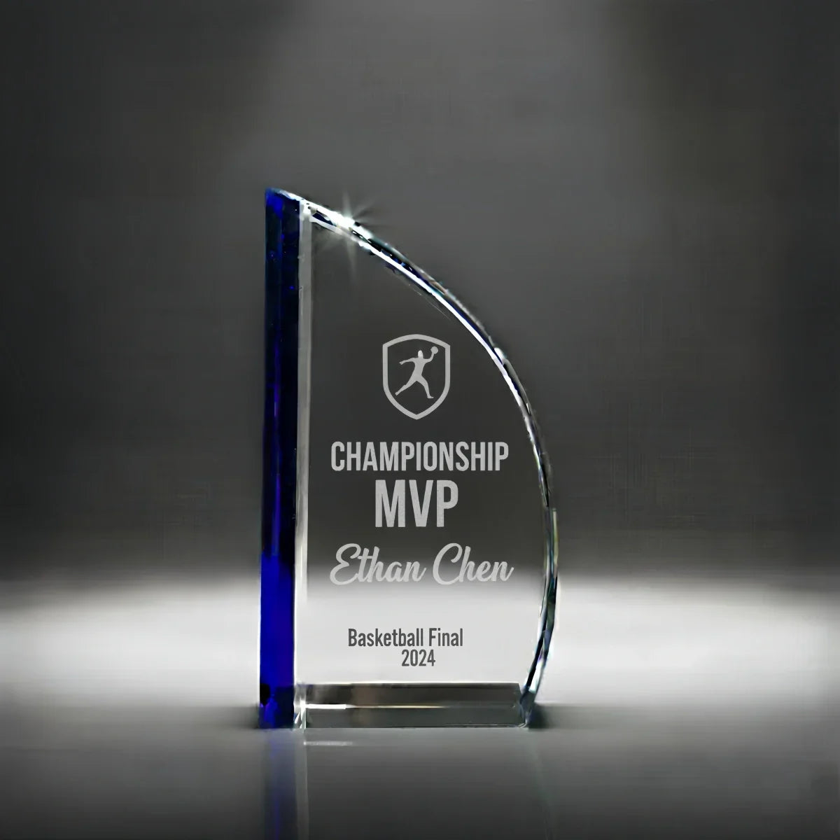 Modern sail-shaped crystal trophy with custom logo engraving