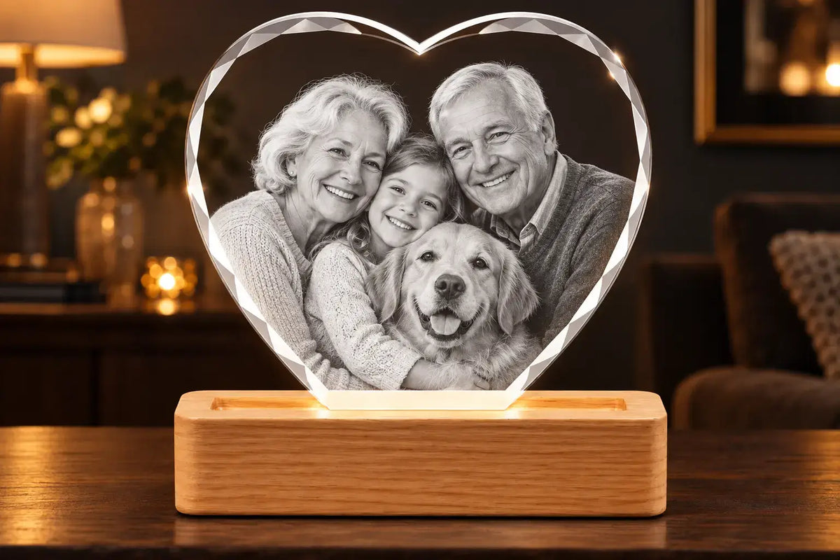 Personalised heart-shaped 3D crystal photo gift with a family portrait on an illuminated wooden LED base