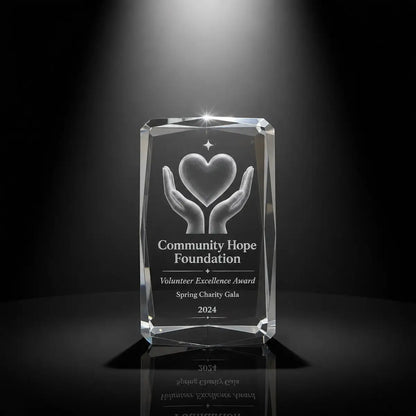 Custom 3D crystal award trophy faceted cube with personalised engraving, featuring hands and heart design for volunteer excellence, charity recognition and community appreciation awards.