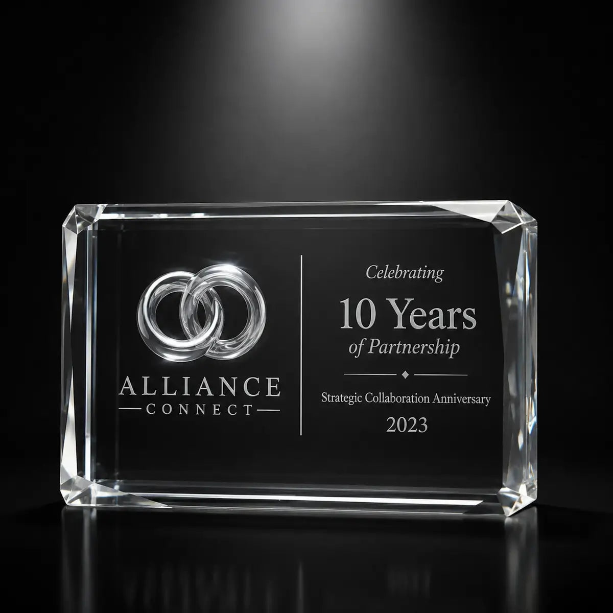 Custom 3D crystal award trophy faceted landscape with personalised engraving, featuring linked rings design for 10 year partnership, strategic collaboration anniversary and business partner recognition.