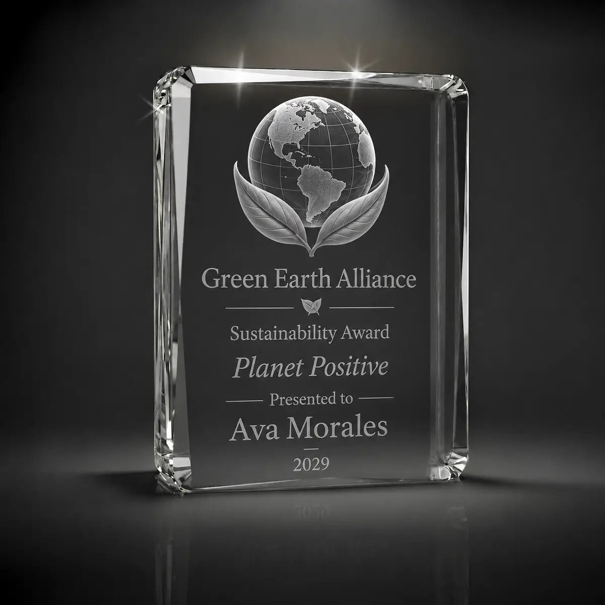 Custom 3D crystal award trophy faceted portrait with personalised engraving, featuring globe and leaf design for sustainability awards, green business recognition and environmental achievement.