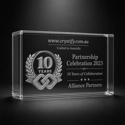 Custom 3D crystal award trophy landscape with personalised engraving, featuring 10 year partnership emblem and linked chain design for collaboration, business anniversary and partner recognition.