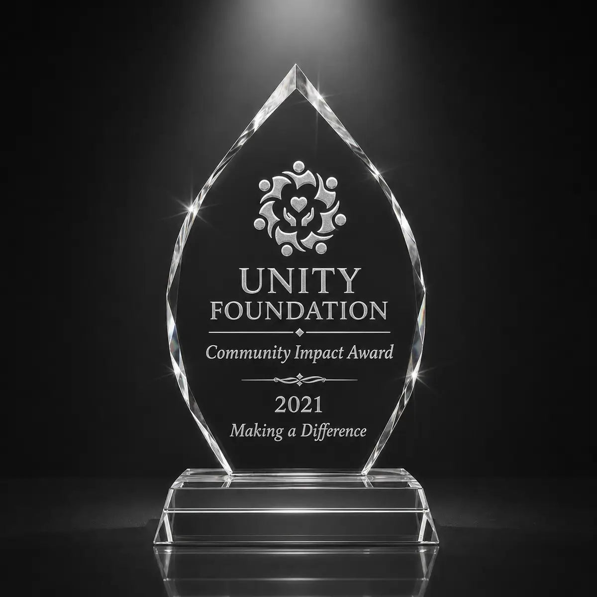 Custom arrowhead crystal community impact award trophy with personalised engraving, faceted glass plaque for nonprofit, charity and volunteer recognition.