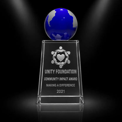 Custom blue globe crystal award trophy with personalised engraving for community impact recognition, featuring a clear crystal base and blue globe top for nonprofit, charity and volunteer awards.