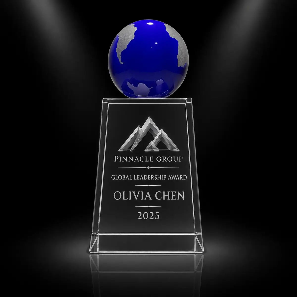 Custom blue globe crystal award trophy with personalised engraving for global leadership recognition, featuring a clear crystal base and blue globe top for corporate awards and executive achievement.