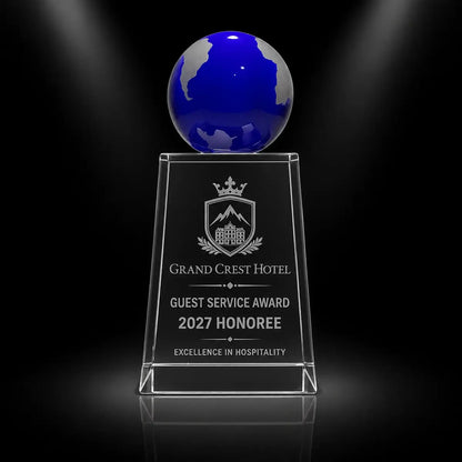 Custom blue globe crystal award trophy with personalised engraving for guest service excellence, featuring a clear crystal column and blue globe top for hospitality and hotel staff recognition.
