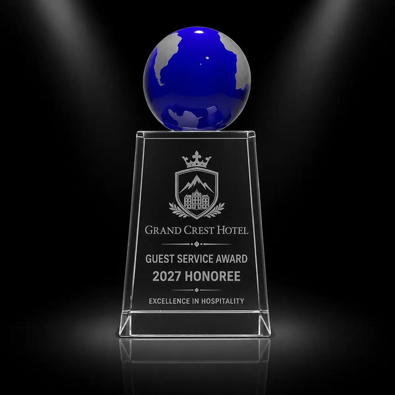 Custom blue globe crystal award trophy with personalised engraving for guest service excellence, featuring a clear crystal column and blue globe top for hospitality and hotel staff recognition.