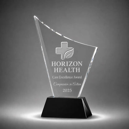 Custom curved crystal care excellence award trophy with personalised engraving, clear glass plaque and black base for healthcare recognition, nursing awards and medical staff appreciation.