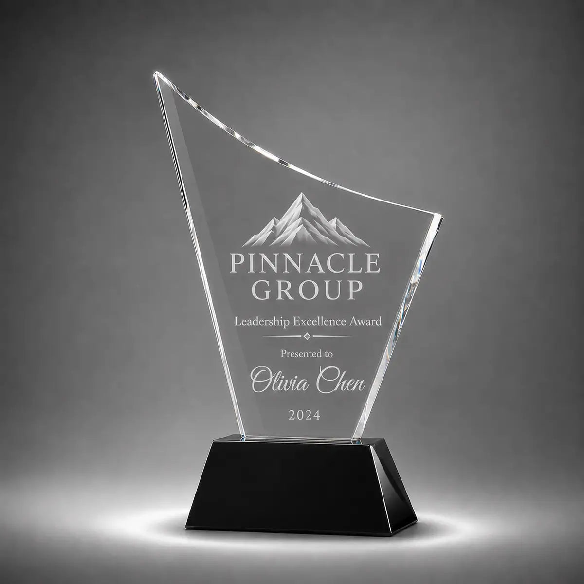 Custom curved crystal leadership excellence award trophy with personalised engraving, clear glass plaque and black base for corporate recognition, executive awards and business achievement.