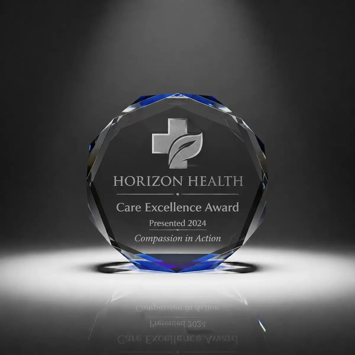 Custom octagon crystal care excellence award trophy with personalised engraving, blue faceted edge design for healthcare recognition, nursing awards and medical staff appreciation.