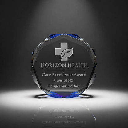 Custom octagon crystal care excellence award trophy with personalised engraving, blue faceted edge design for healthcare recognition, nursing awards and medical staff appreciation.
