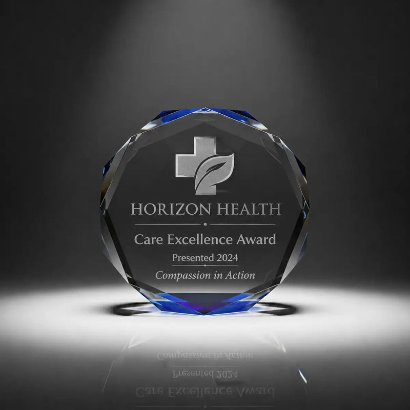 Custom octagon crystal care excellence award trophy with personalised engraving, blue faceted edge design for healthcare recognition, nursing awards and medical staff appreciation.