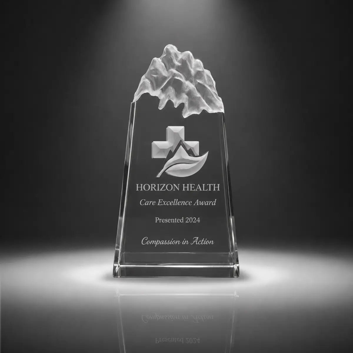 Custom peak crystal care excellence award trophy with personalised engraving, clear mountain top design for healthcare recognition, nursing awards and medical staff appreciation.
