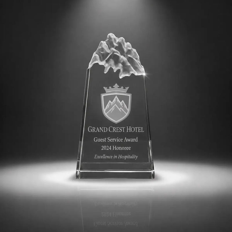 Custom peak crystal guest service award trophy with personalised engraving, clear mountain top design for hotel staff recognition, hospitality awards and service excellence.