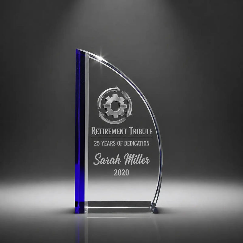 Custom sail crystal retirement tribute award trophy with personalised engraving, clear glass plaque with blue accent for long service, dedication and employee recognition.