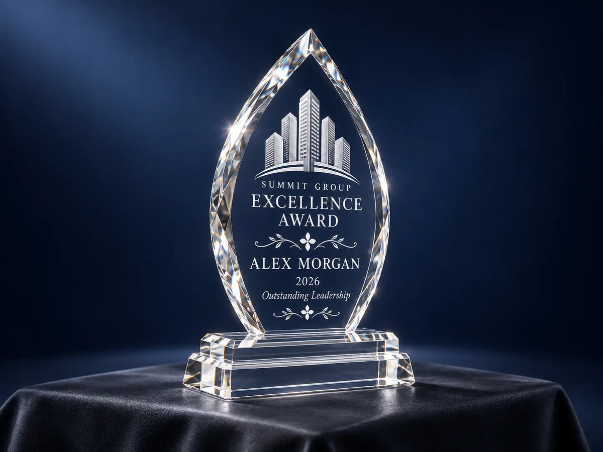 Arrowhead K9 crystal award with polished bevelled edges and a stepped base against a navy background